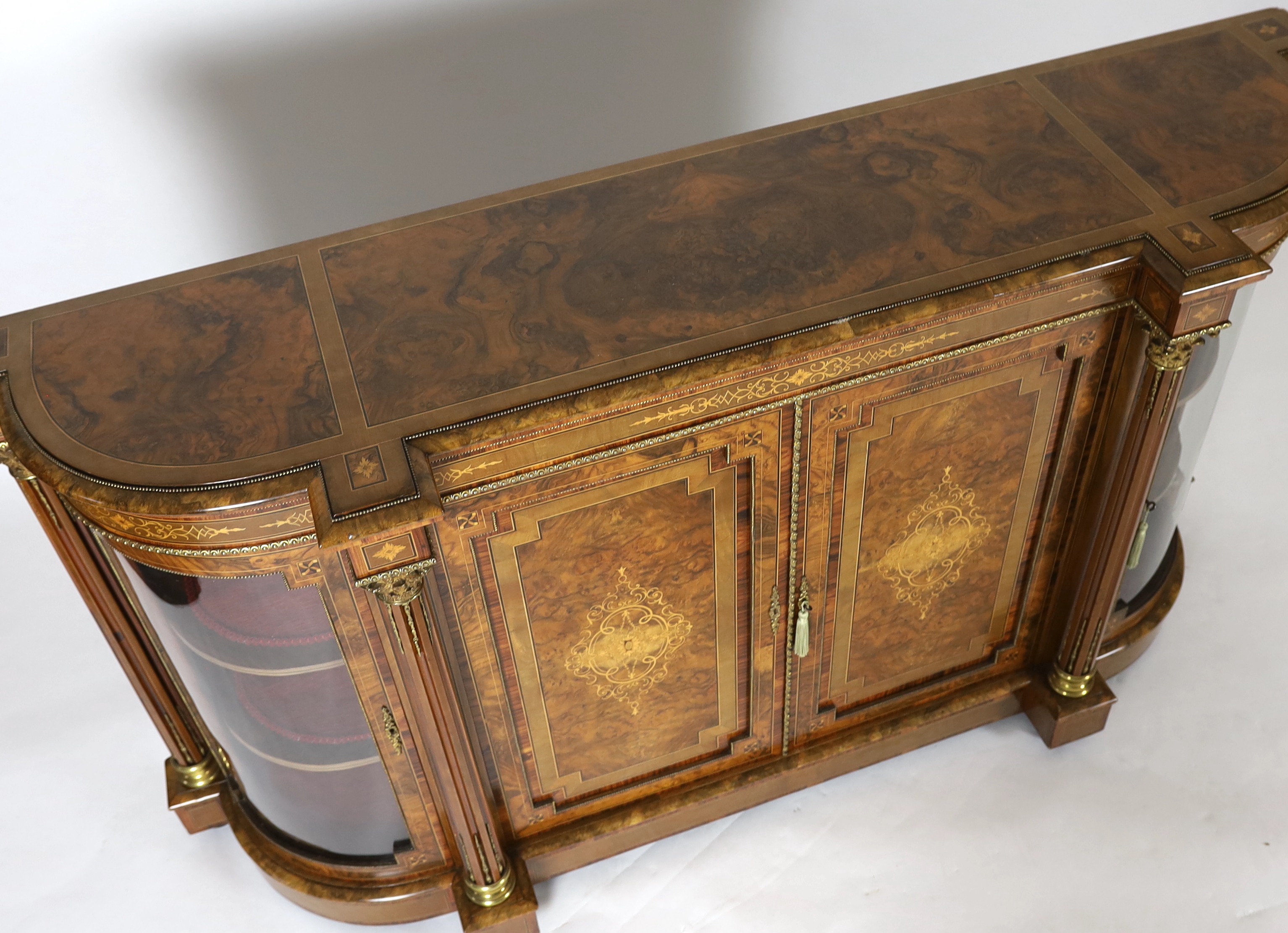 A Victorian marquetry inlaid figured walnut credenza 194cm wide, 49cm deep, 108cm high